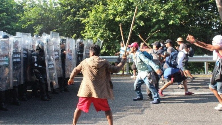 Se enfrentan caravana migrante y la Guardia Nacional